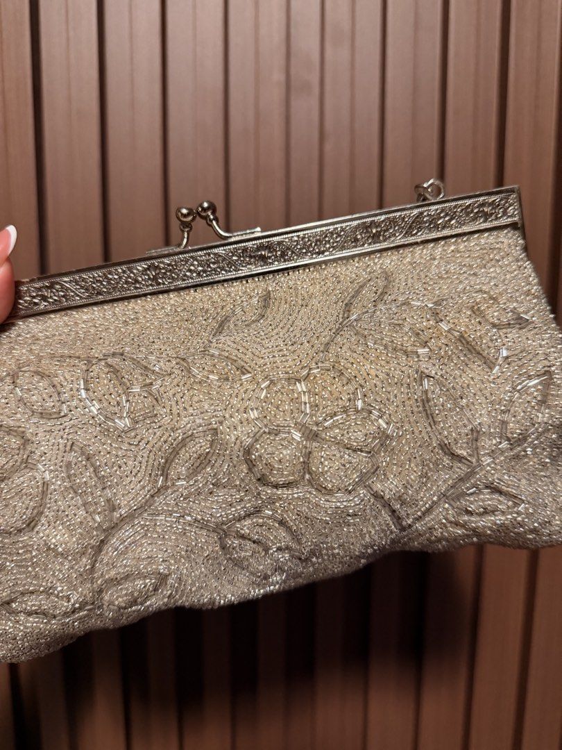 Silver Beaded Vintage Kiss-Lock Handbag (Category: Clutches) located in Manila. Submitted by azhein_ (Listing ID 1456531018, Image 2). Description: Silver Beaded Vintage Kiss-Lock Handbag Condition 8.5/10 - a faveee - perfect for event or casual date night - a treasure find indeed!! Issues: SEE PICTURES ❗️but as a whole this bag is pretty good. Price: ₱ 350 + sf 📍Taft Ave. 🚛: Lalamove/J&T ⚠️ Manage expectations since this is a pre-owned item. N