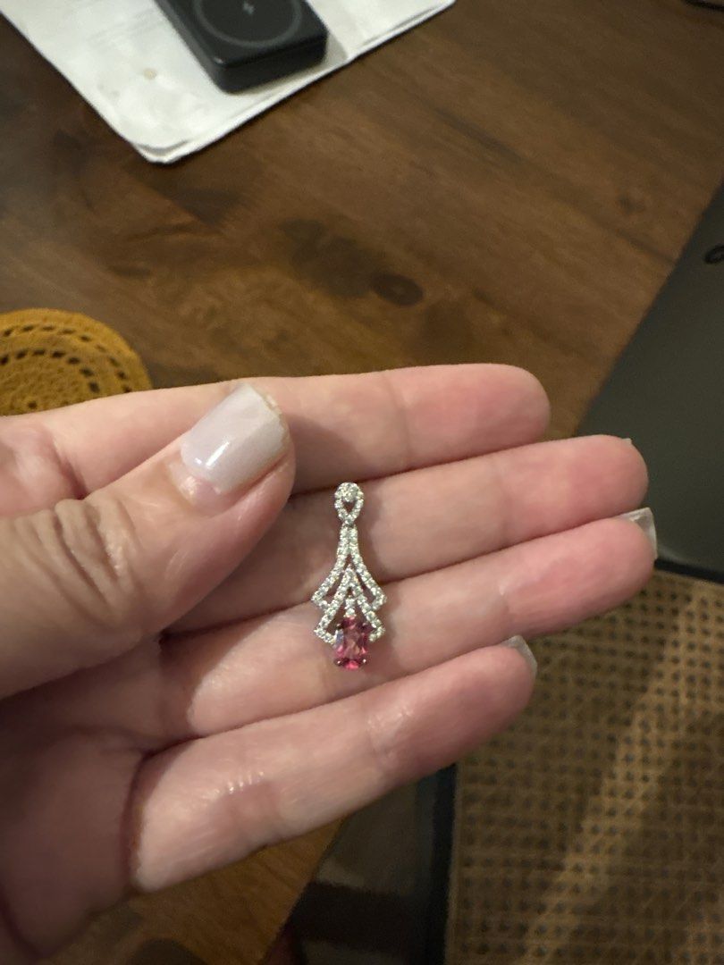 Silver Tone Pendant with Pink Gemstone and Crystals (Category: Necklaces) located in Paranaque City. Submitted by immedj (Listing ID 1456524476, Image 3). Description: - Elegant pendant with a central pink oval topaz gemstone. - Accented with sparkling clear crystals in a decorative s925 silver setting. - Top loop also features crystal detailing. - Beautiful and eye-catching design. - with certificate - bought from China - pay by gcash or bank tr