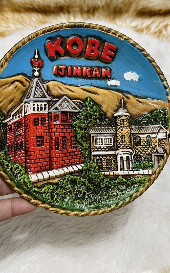 Souvenir display bundle 2 (Category: Frames & Pictures) located in Quezon City. Submitted by sissymissy1527 (Listing ID 1456532954, Image 2). Description: 1.Round Pickles & Chutneys vintage-style Ceramic coaster 2. Round 3D resin souvenir featuring the historic Ijinkan Western-style architecture district in Kobe, Japan, highlighted by a prominent red building against a blue sky with embossed “KOBE IJINKAN” lettering.Such tourist memorabilia from 