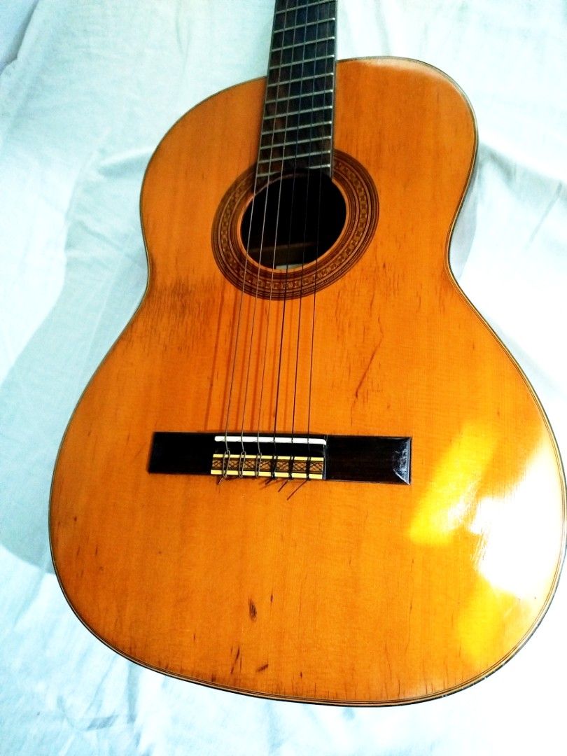 Suzuki Acoustic Guitar - Vintage Classical (Category: Musical Instruments) located in Quezon City. Submitted by fiercefish-ad37 (Listing ID 1456473203, Image 1). Description: - Vintage Suzuki Classical Acoustic Guitar beautiful sounds - Made in Japan - Serial Number: 36R -solid cedar top -rosewood Beautiful wood grain on back and sides -ebony fretboard and bridge - Minor scuffs from normal use - Tuners in good working order - Ideal for beginners 