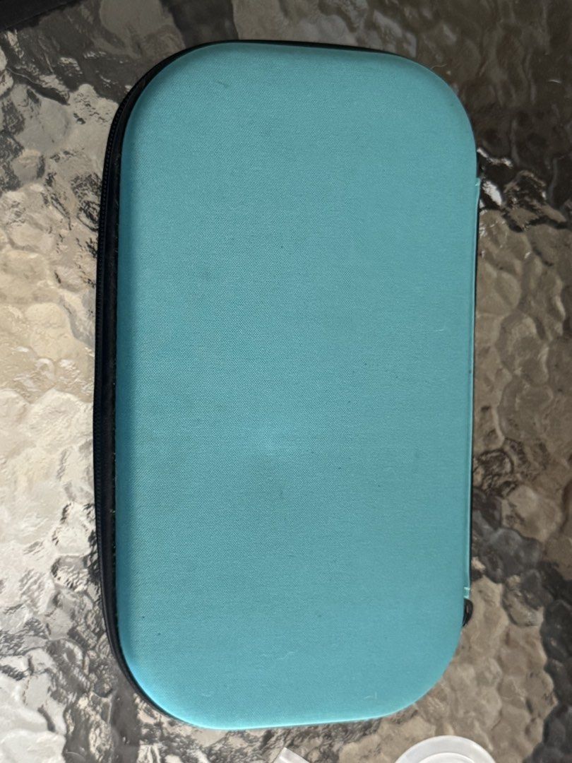 Teal Hard Shell Storage Case with Interior Compartments (Category: Storage Boxes & Baskets) located in Cebu City. Submitted by kdlsstuff (Listing ID 1456466855, Image 2). Description: - Teal hard shell storage case - Zipper closure for secure storage - Molded compartments inside for organized storage of small items - Mesh pocket on the other side for additional organization - Ideal for travel or keeping your belongings tidy.
