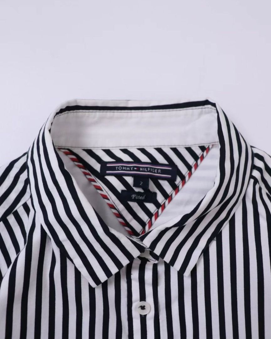 TH Button Down (Category: Tshirts & Polo Shirts ) located in Pasig City. Submitted by marcmesa (Listing ID 1456567446, Image 3). Description: Pinstripe Detail. Embroidered Logo. Classic Piece 🍸 AUTHENTIC A92 Condition: Excellent Size: Women's XS | L25" x W17".
