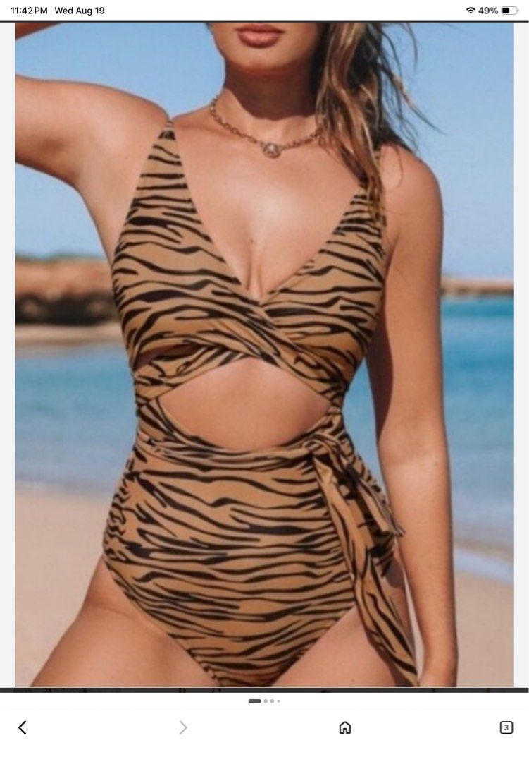 Tiger Print One-Piece Swimsuit with Tie Front (Category: Bikinis & Swimsuits) located in Tarlac. Submitted by rieselects (Listing ID 1456579696, Image 2). Description: - Trendy tiger print one-piece swimsuit - Flattering tie-front detail at the bust - Stylish side cut-outs - Adjustable spaghetti straps for a perfect fit - White lining - Ideal for your next beach or pool outing.