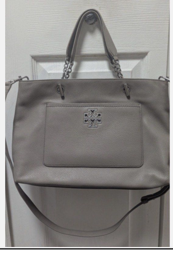 Tory Burch Pebbled Leather Tote Bag (Category: Luxury Bags & Wallets) located in Muntinlupa City. Submitted by rmsalberto (Listing ID 1455530761, Image 1). Description: Guaranteed authentic - Tory Burch tote bag - Color: Gray - Material: Pebbled leather - Hardware: Silver - Interior: Multiple compartments, 1 zip pocket - Includes: Dustbag, Detachable crossbody strap, convertible to handbag - Spacious for daily essentials.