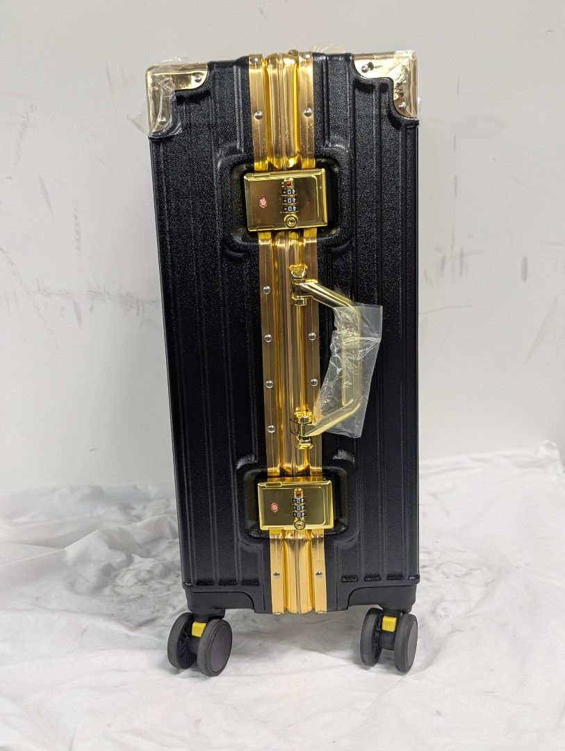 TSA-Lock Secured (Category: Luggage) located in Singapore. Submitted by general-merchandise (Listing ID 1456429607, Image 3). Description: - TSA-LOCK Secure, Stylish blue suitcase with gold accents - Spacious interior with multiple compartments - Features a handle and wheels for easy transport - with 1 replacement wheel and belt luggage - 21×15×10 - I'm a genuine seller and buyer, my old account I cannot open. I'm trustworthy / honesty, can searc
