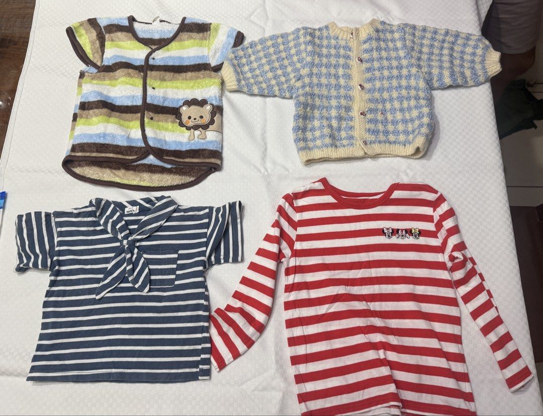 Uniqlo Baby Clothes Bundle (Category: Babies & Kids Fashion) located in Muntinlupa City. Submitted by readthedetails (Listing ID 1456549596, Image 1). Description: - Bundle of 4 baby tops - All size 100cm - Includes: - Uniqlo striped long-sleeve top - Blue and yellow checkered knit cardigan - Striped sailor-style top - Striped short-sleeve top with lion graphic - Great for everyday wear.
