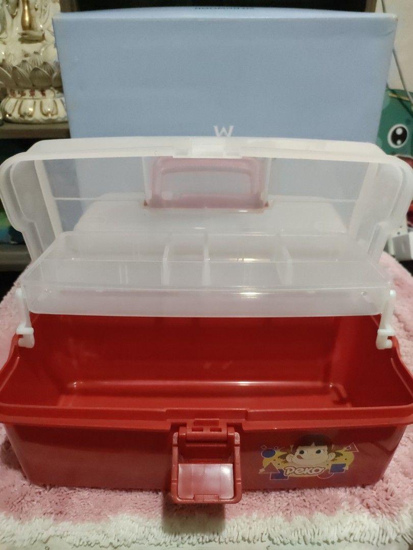 Vintage Fujiya Peko Tool box (Category: Storage Boxes & Baskets) located in Bulacan. Submitted by hunterherojapanjdm (Listing ID 1456581803, Image 3). Description: -Vintage Fujiya Peko-chan red and translucent plastic stacking tool and storage boxes featuring the classic character graphics. -Design: Red base with a translucent lid, a red carrying handle, and a red front locking latch. -Graphics: Features an illustration of Peko-chan with colorful
