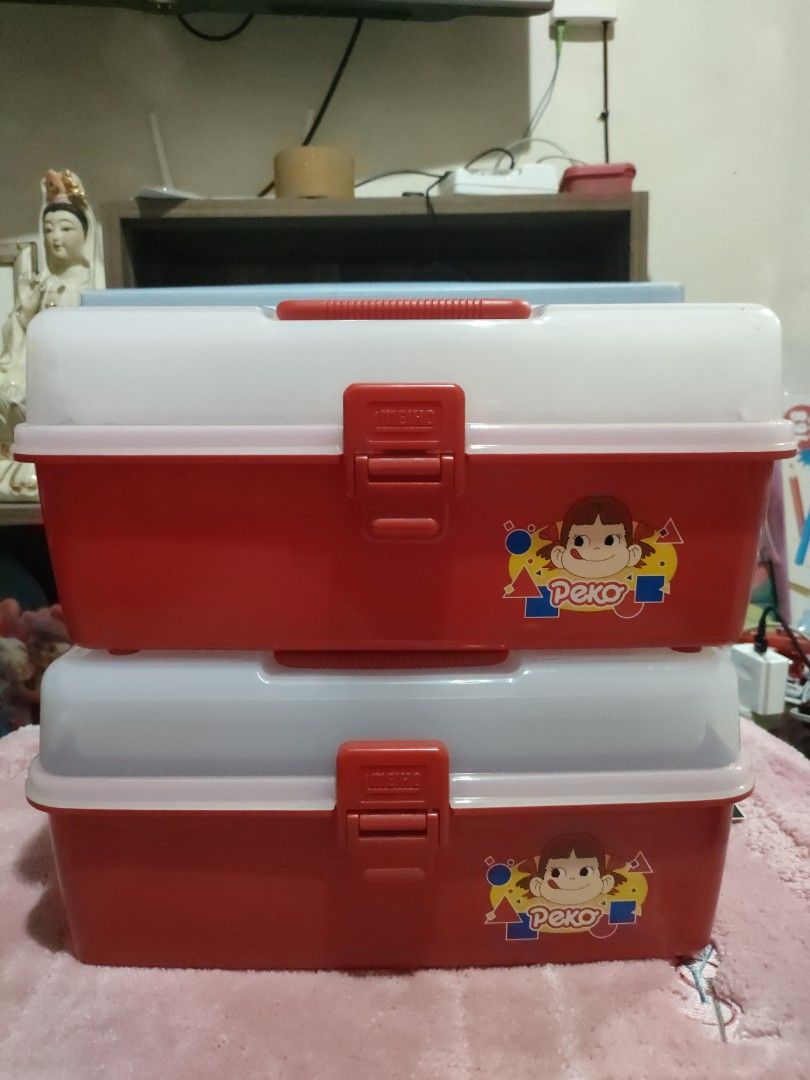 Vintage Fujiya Peko Tool box (Category: Storage Boxes & Baskets) located in Bulacan. Submitted by hunterherojapanjdm (Listing ID 1456581803, Image 1). Description: -Vintage Fujiya Peko-chan red and translucent plastic stacking tool and storage boxes featuring the classic character graphics. -Design: Red base with a translucent lid, a red carrying handle, and a red front locking latch. -Graphics: Features an illustration of Peko-chan with colorful