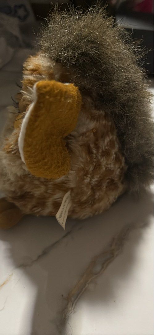 Vintage Furby Toy (Category: Interactive Toys) located in Pasig City. Submitted by rarelion_f7ba92 (Listing ID 1456578877, Image 3). Description: - Classic Furby toy - Color: Light brown and tan - Features: Big blue eyes, fuzzy ears - Condition: Fur is a bit worn in places - Ideal for: Collectors, electronics toy enthusiasts, display .