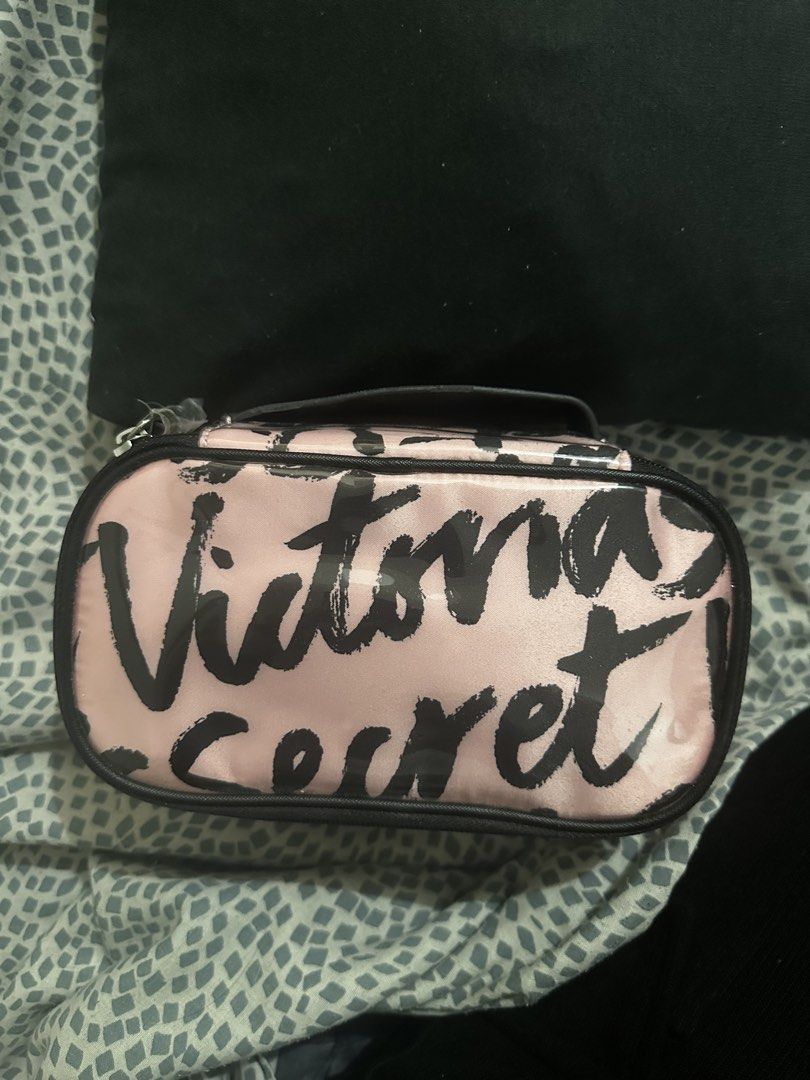 VS makeup pouch- travel case (Category: Makeup) located in Manila. Submitted by rarejap808 (Listing ID 1456532861, Image 1). Description: 100% Authentic, purchased directly from a Victoria’s Secret store in Dubai. Signature pink and black brushstroke print with the iconic “Victoria’s Secret” logo design. ✨ Details: • Like new condition — barely used • Clean interior, no stains or odor • Fully functional zipper • Great for makeup, toiletries, or a