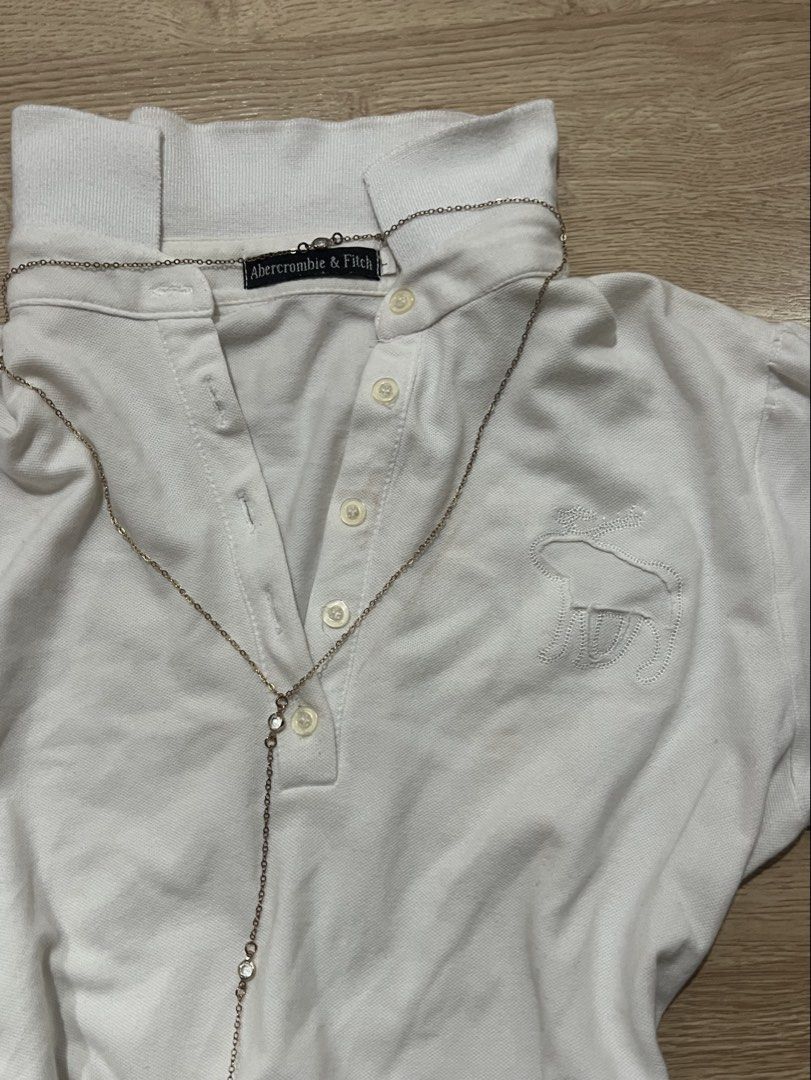 White Aberocrombie & Fitch polo (Category: Shirts) located in Manila. Submitted by curateeeddd (Listing ID 1456548334, Image 3). Description: has some small stains but not noticable when worn.