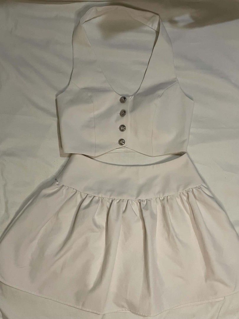 White Halter Neck Top and Mini Skirt Coords (Category: Sets or Coordinates) located in Binan City. Submitted by declutterbyjwy (Listing ID 1456498008, Image 1). Description: top (bust: 34-35" | waist: 26-27 | length: 16.5") skirt (waist: 24-25 | length: 14") - good as new, never used - versatile: can be worn together or separately - Last price posted!.