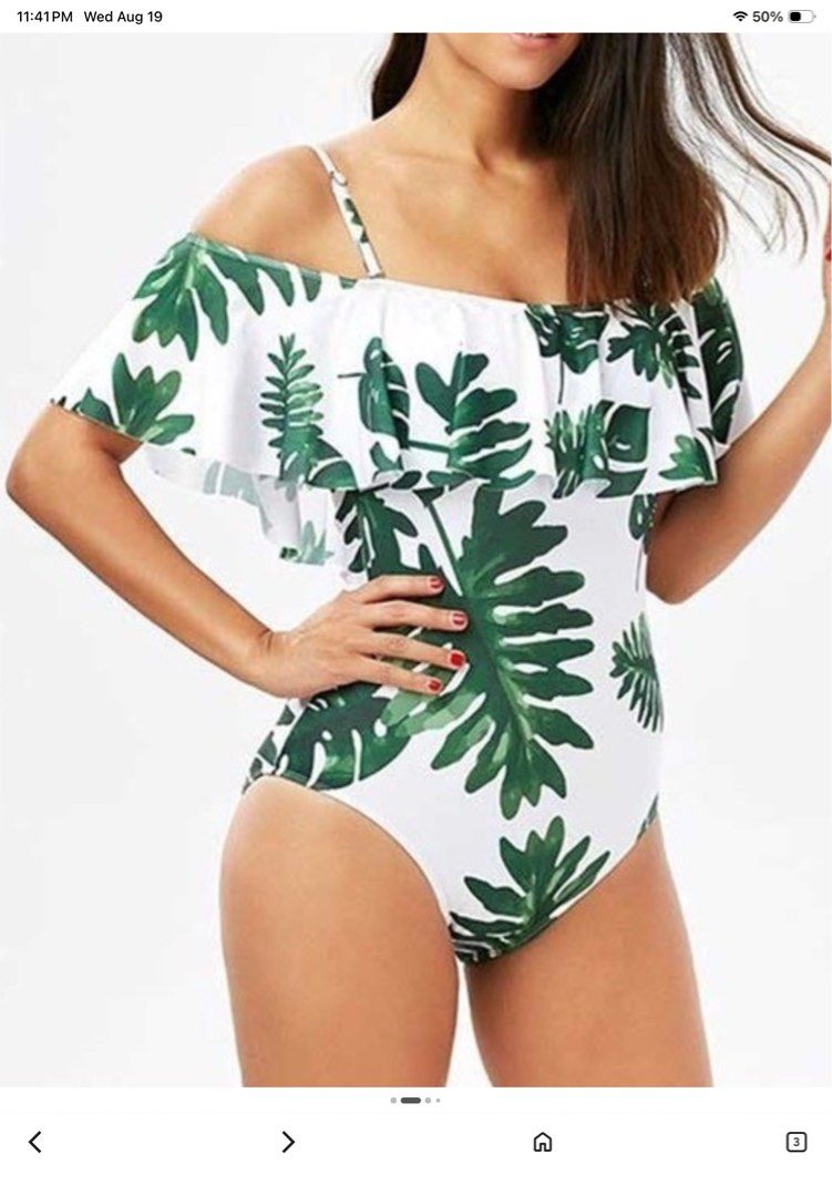 White One-Piece Swimsuit with Green Leaf Print (Category: Bikinis & Swimsuits) located in Tarlac. Submitted by rieselects (Listing ID 1456579707, Image 2). Description: - Cute one-piece swimsuit - Tropical leaf print (white base with bold green leaves) - Off-the-shoulder ruffle sleeves - Adjustable spaghetti straps - Ideal for beach or pool - Comfortable and stylish.