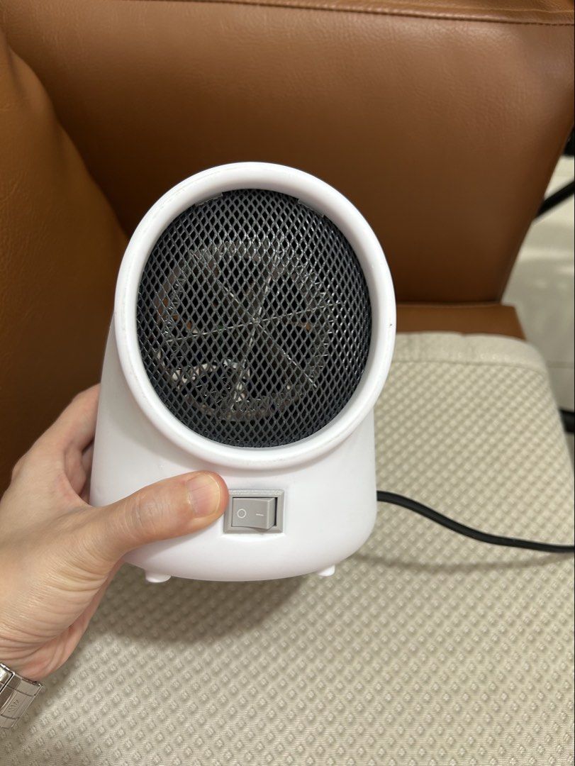 White Portable Electric Heater with Fan (Category: Fans) located in Manila. Submitted by raynebow (Listing ID 1456430535, Image 1). Description: - Compact electric heater, ideal for personal space. - Simple on/off switch for easy operation. - Features a European type plug. - Small and lightweight for easy portability. - Perfect for heating a desk area or small room. - Provides quick and efficient warmth..