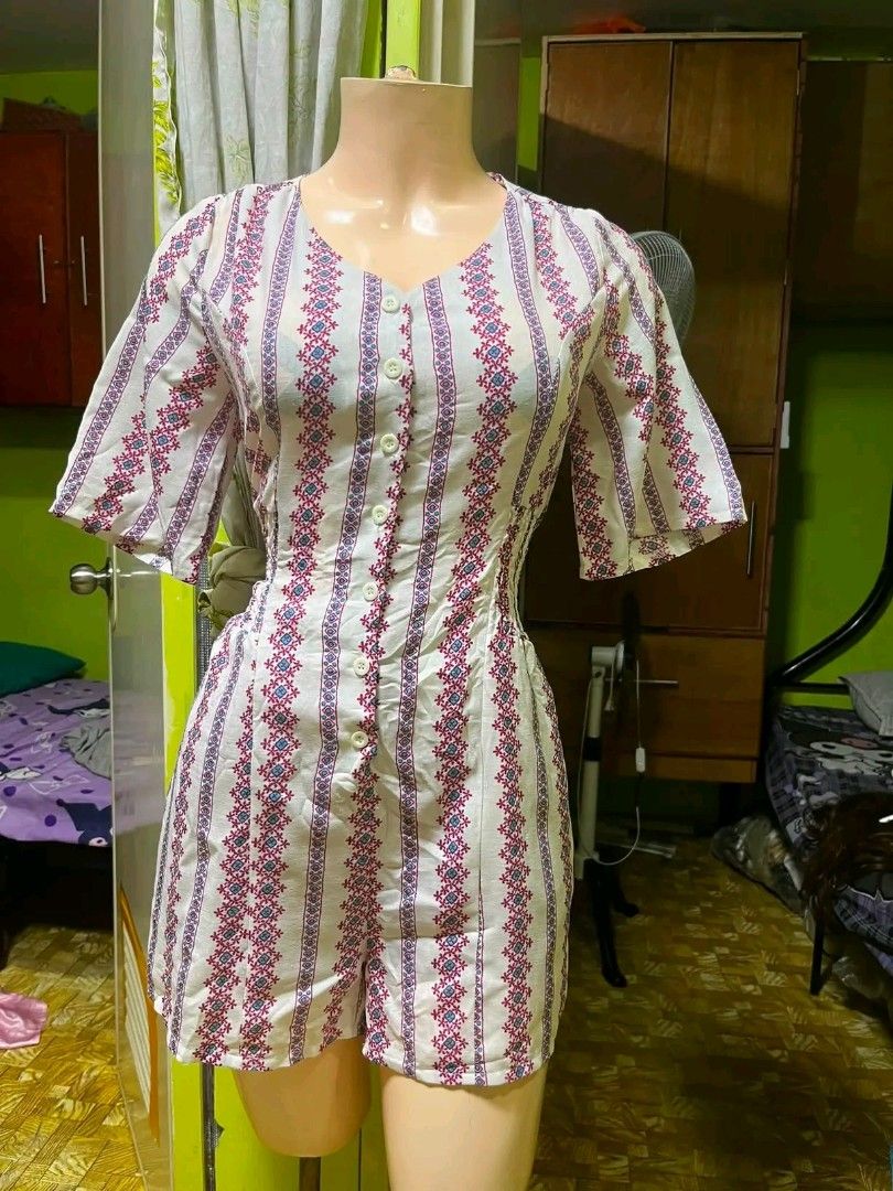 White Romper with Pink and Blue Geometric Print (Category: Rompers) located in San Pablo. Submitted by binibining14812 (Listing ID 1456546714, Image 1). Description: - Adorable white romper with a fun geometric print. - Features short flutter sleeves. - Convenient button-down front. - Cinched waist for a flattering silhouette. - Ideal for casual wear, beach trips, and everyday comfort..