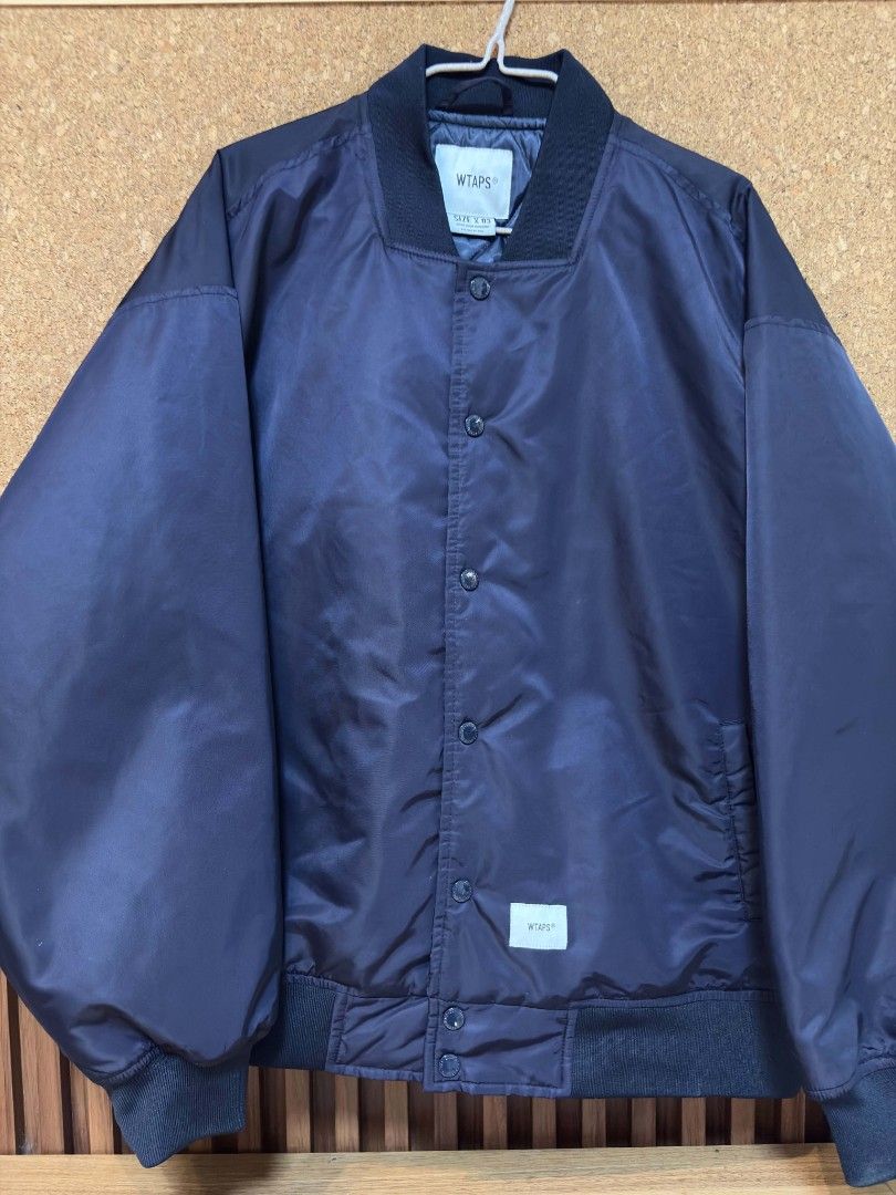 WTAPS Team Jacket (Category: Coats, Jackets and Outerwear) located in Bacolod City. Submitted by offtocloset (Listing ID 1456501483, Image 2). Description: This features a prominent white embroidered crossbones graphic on the back. The condition of this Jacket is as good as Brand new. Size 03 / Can fit to : L-XL Note: • Free shipping ✅ •Courier J&T🚚 •Negotiable •Gcash Payment/Bank transfer BPI💵.