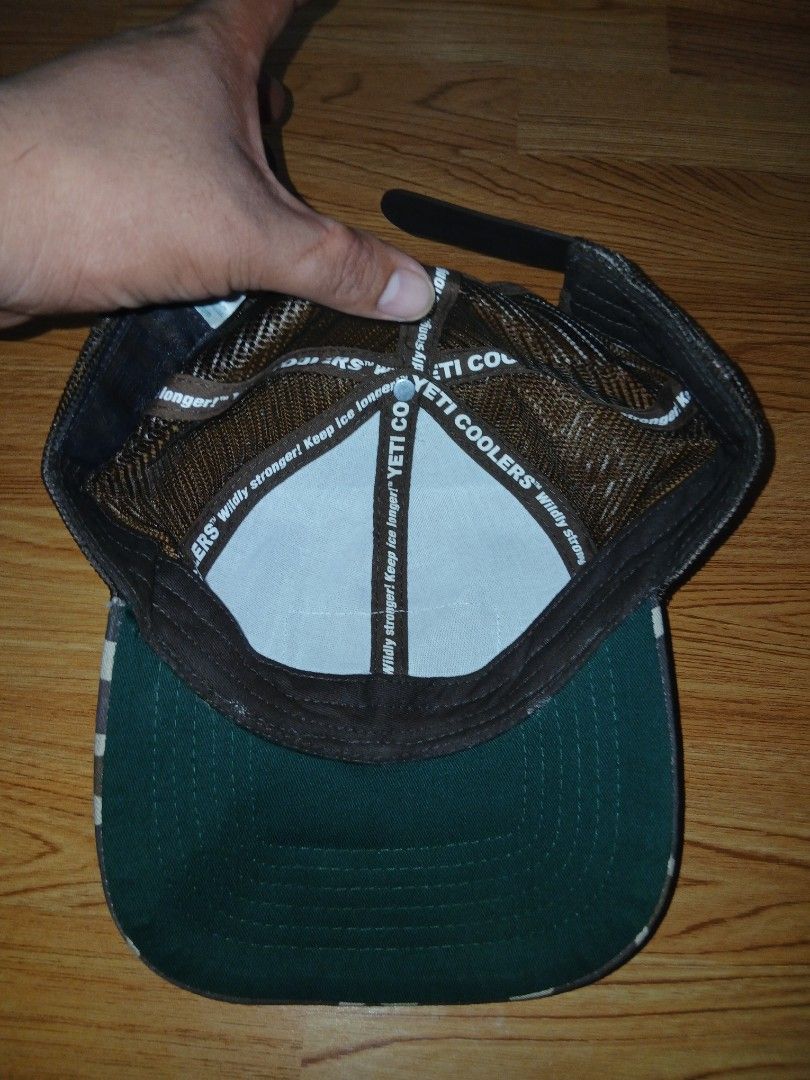 Yeti Coolers Camo Trucker Hat (Category: Caps & Hats) located in General Santos City (Dadiangas). Submitted by afsph1996 (Listing ID 1456525297, Image 3). Description: - Yeti Coolers trucker hat - Camouflage pattern on front and brim - Breathable mesh back - Adjustable snapback closure - Interior band features "Wildly Stronger! Keep Ice Longer! YETI COOLERS" - Ideal for outdoor adventures.