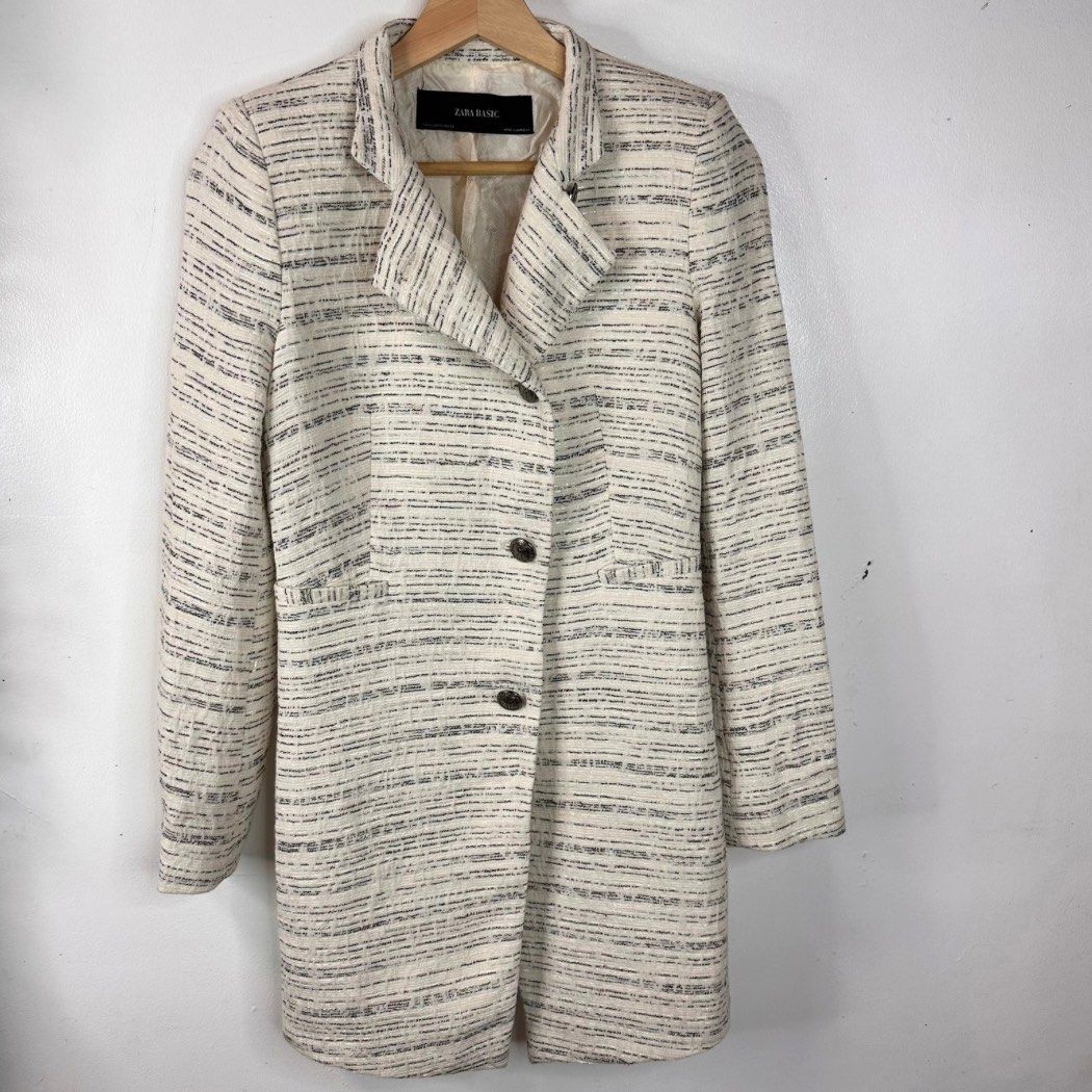 Zara Basic Textured Tweed Long Coat Jacket Size XS/Small (Category: Coats, Jackets and Outerwear) located in Baguio. Submitted by lctrendz (Listing ID 1456489300, Image 1). Description: Zara Basic Textured Tweed Long Coat Jacket Size XS/Small Size and Fit: Small / Slim Fit Fabric: Shell: 75% Cotton, 12% Polyester, 8% Polyamide, 5% Other fibers Lining: Polyester blend Color: Off-white / Cream with black Measurements: Length: 31 inches Bust: 16 inc
