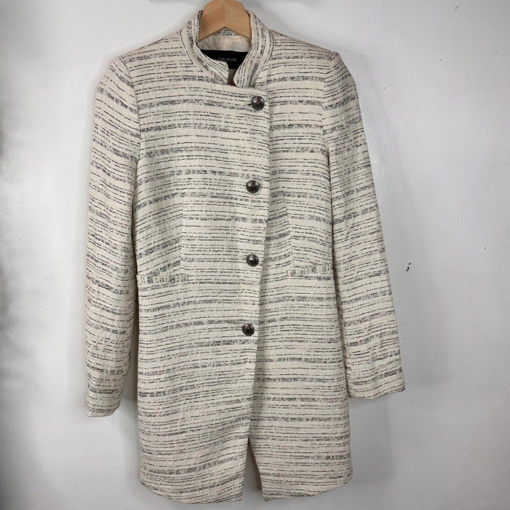 Zara Basic Textured Tweed Long Coat Jacket Size XS/Small (Category: Coats, Jackets and Outerwear) located in Baguio. Submitted by lctrendz (Listing ID 1456489300, Image 2). Description: Zara Basic Textured Tweed Long Coat Jacket Size XS/Small Size and Fit: Small / Slim Fit Fabric: Shell: 75% Cotton, 12% Polyester, 8% Polyamide, 5% Other fibers Lining: Polyester blend Color: Off-white / Cream with black Measurements: Length: 31 inches Bust: 16 inc