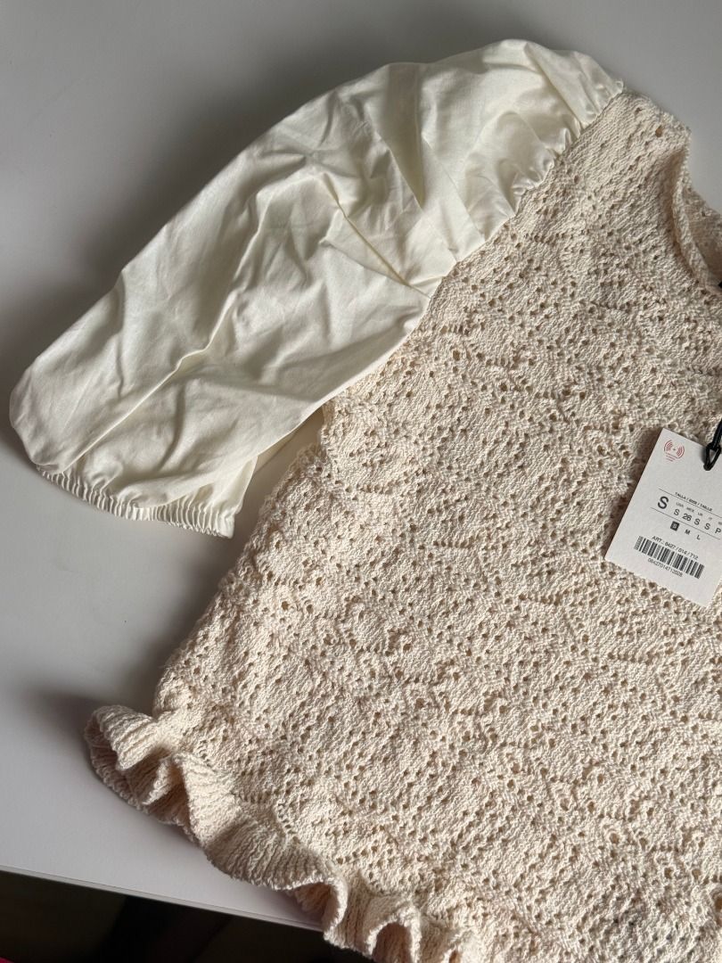 Zara Cream Crochet Top (Size S) (Category: Blouses) located in San Juan City. Submitted by maxiepie (Listing ID 1456573087, Image 2). Description: Brand new and selling for 50% off. Comes with original tag. Features: - Retails for approximately $44 or P2,700 - Crocheted body with puff sleeves - Can be dressed up or down - Perfect for summery, casual, boho, beach, and city looks - Size S RFS: Gift, won't use.