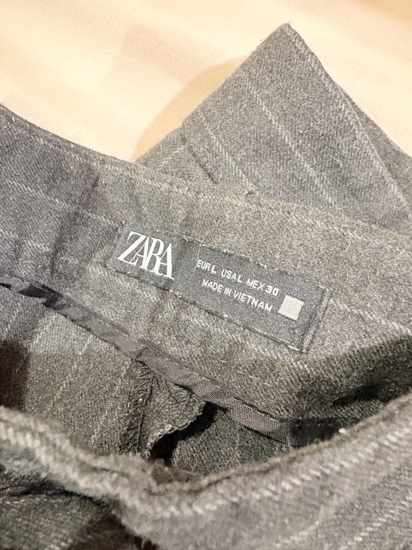 Zara Striped Tailored Pants (Category: Other Bottoms) located in Manila. Submitted by sofiacarm15 (Listing ID 1456533950, Image 2). Description: - Zara Grey Pinstripe Pants - Size: L - Tailored fit for a classic look - Features belt loops and zip closure - Ideal for workwear or smart casual outfits - No flaws, but used a lot of times.