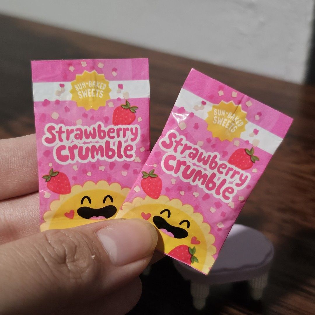 Miniverse Strawberry Crumble Sun-Baked Sweets (Category: Other Home Decor) located in Rizal. Submitted by viviperera (Listing ID 1456595633, Image 1). Description: price per piece as is - Delicious Strawberry Crumble sweets - Sun-baked for a perfect crunch - Adorable pink packaging with strawberry and sun graphics - Ideal for a quick and tasty snack - Selling 2 packets.