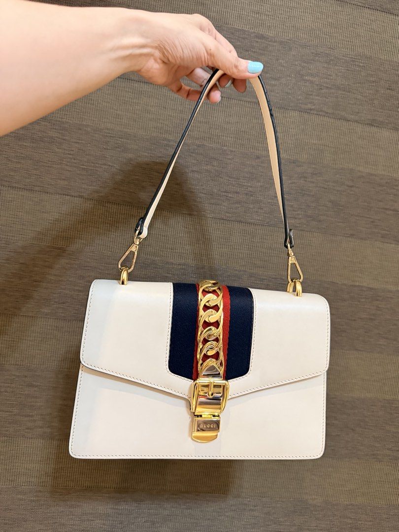 99% New Gucci Sylvie Shoulder Bag Complete Set (Category: Luxury Bags & Wallets) located in Manila. Submitted by sweetluxuryph (Listing ID 1453046604, Image 3). Description: - Gucci Sylvie shoulder bag - Condition: 99% new (like new) - Comes with complete set - Original store price: PHP 150,000 - Selling price: PHP 44,000 - Features: Beautiful, chic, and stylish - Versatile: Perfect for any occasion.