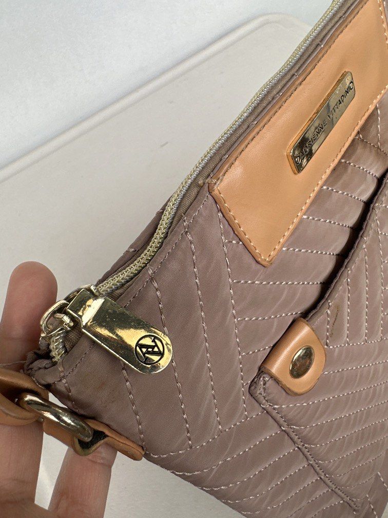 Adrienne Vittadini Crossbody Bag (Category: Cross-body Bags) located in Manila. Submitted by classywardrobemanila (Listing ID 1453295018, Image 3). Description: Adrienne Vittadini Taupe/Gray quilted crossbody Purse w/outside pocket. Top closure is zipper. Great, preowned condition. Bag width: 10inches Material: Quilted polyester/nylon. Features: Adjustable crossbody strap, front pocket with snap closures, and interior pockets. As this is a used i