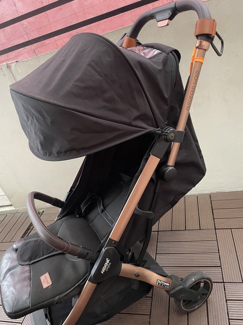 Akeeva Autofold Gold Lightweight Travel Stroller (Category: Strollers) located in Pasig City. Submitted by macsanceda (Listing ID 1453327122, Image 2). Description: - Lightweight and easy autofold - Solid molded seat for great back support - Magnetic buckle belt for quick securing - Removable leather front bar - Full canopy for sun protection - Adjustable legrest for comfort - Large shopping basket - 5-point safety harness - Wheels with suspensio