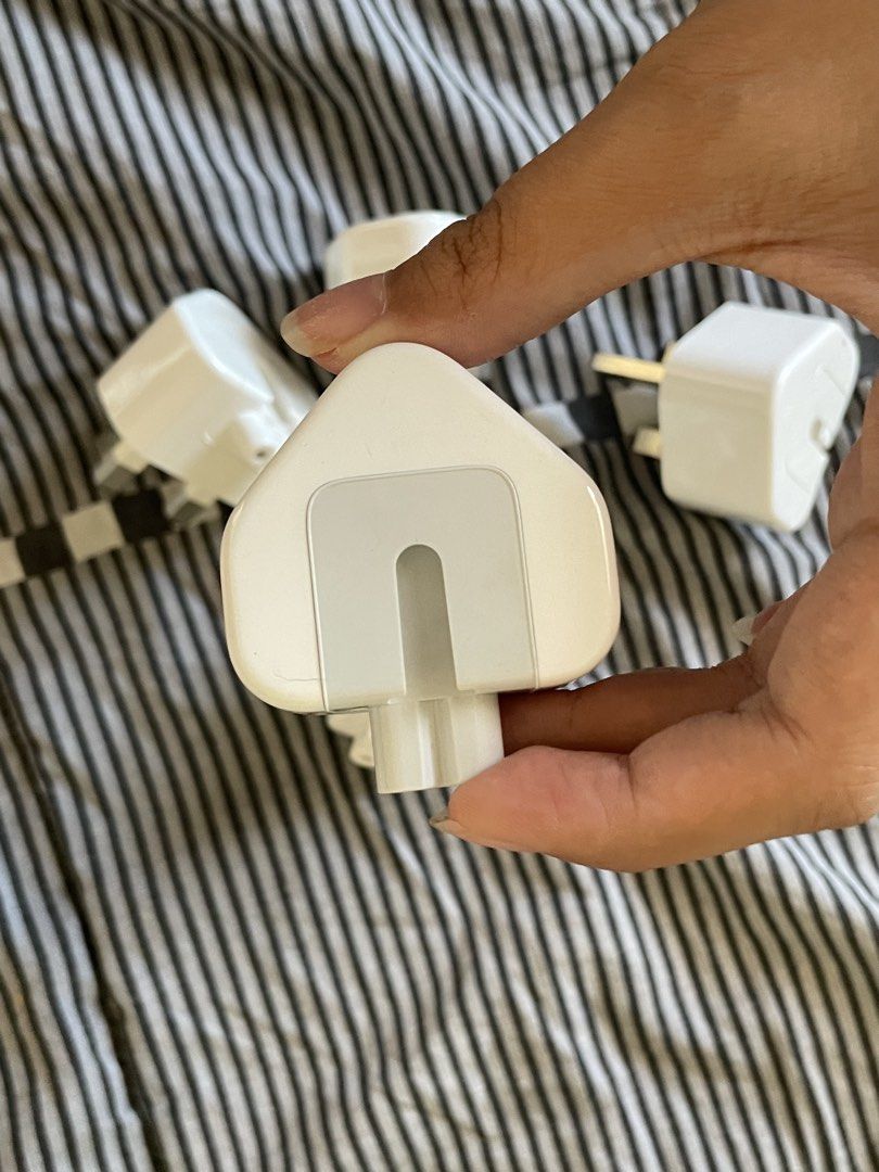 Apple AC Wall Plug Duckhead Adapter (UK / Type G 3-Pin) (Category: Chargers & Cables) located in Manila. Submitted by declutteredbyalex (Listing ID 1453280869, Image 3). Description: Original-style UK / Type G (3-pin) duckhead plug attachments for Apple power adapters. PHP 250 - Available per piece or as a take-all bundle Great if you: - Are traveling to UK, Singapore, Hong Kong, Malaysia, UAE, etc. - Need a cheap spare/replacement wall plug for 
