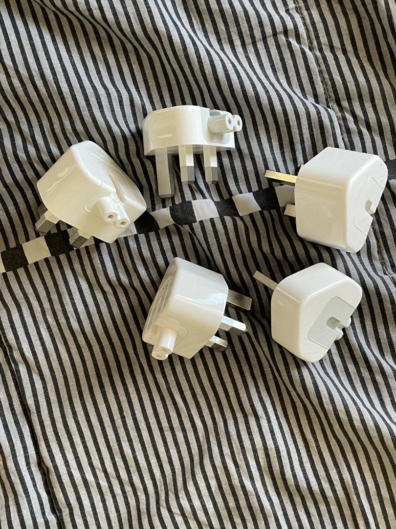 Apple AC Wall Plug Duckhead Adapter (UK / Type G 3-Pin) (Category: Chargers & Cables) located in Manila. Submitted by declutteredbyalex (Listing ID 1453280869, Image 2). Description: Original-style UK / Type G (3-pin) duckhead plug attachments for Apple power adapters. PHP 250 - Available per piece or as a take-all bundle Great if you: - Are traveling to UK, Singapore, Hong Kong, Malaysia, UAE, etc. - Need a cheap spare/replacement wall plug for 