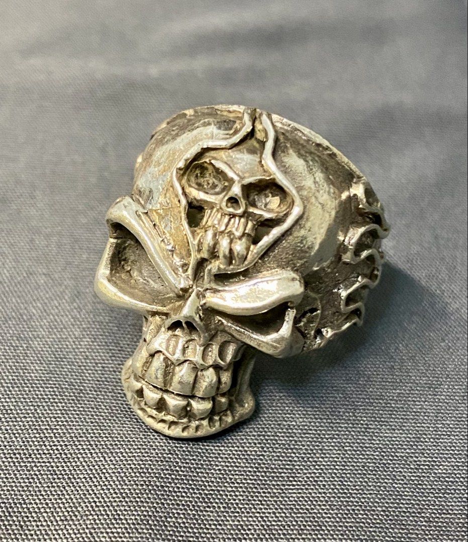 Authentic Custom 925 Silver Skull Ring with Flame Details (Category: Jewelry) located in Iloilo. Submitted by mrstrauss (Listing ID 1453369647, Image 1). Description: -Size 9.5 - Unique skull ring with intricate detailing. - Features cool flame accents on the sides. - A perfect statement piece to elevate any outfit. - Stand out with this one-of-a-kind design..