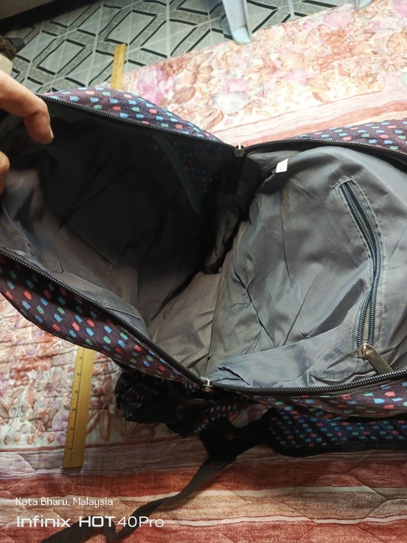 Backpack Kipling (Category: Backpacks) located in Kuala Lumpur. Submitted by grandturtle_dd5ca3 (Listing ID 1453422822, Image 3). Description: Brand: Kipling Model: Likely the Delia Mini or similar City Pack style Design: Black base with a multi-colored geometric pattern.