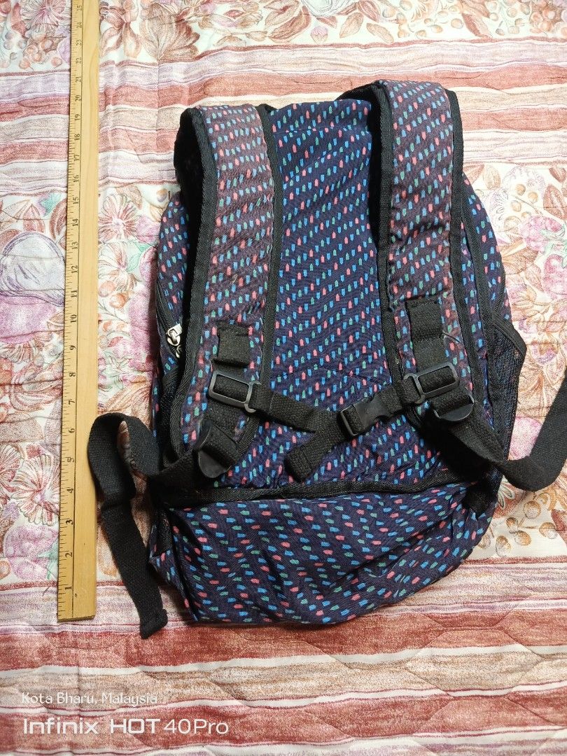 Backpack Kipling (Category: Backpacks) located in Kuala Lumpur. Submitted by grandturtle_dd5ca3 (Listing ID 1453422822, Image 2). Description: Brand: Kipling Model: Likely the Delia Mini or similar City Pack style Design: Black base with a multi-colored geometric pattern.