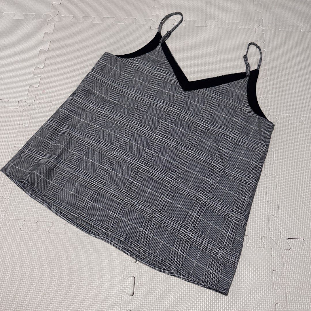 Banana Republic Plaid Cami Top S/P (Category: Sleeveless) located in Marikina City. Submitted by prelovedsms (Listing ID 1453311949, Image 3). Description: - Grey plaid cami top - Brand: Banana Republic - Features adjustable straps - Black trim along neckline - Chest measurement: approx. 16 inches - Versatile for layering or wearing alone Big sizing.