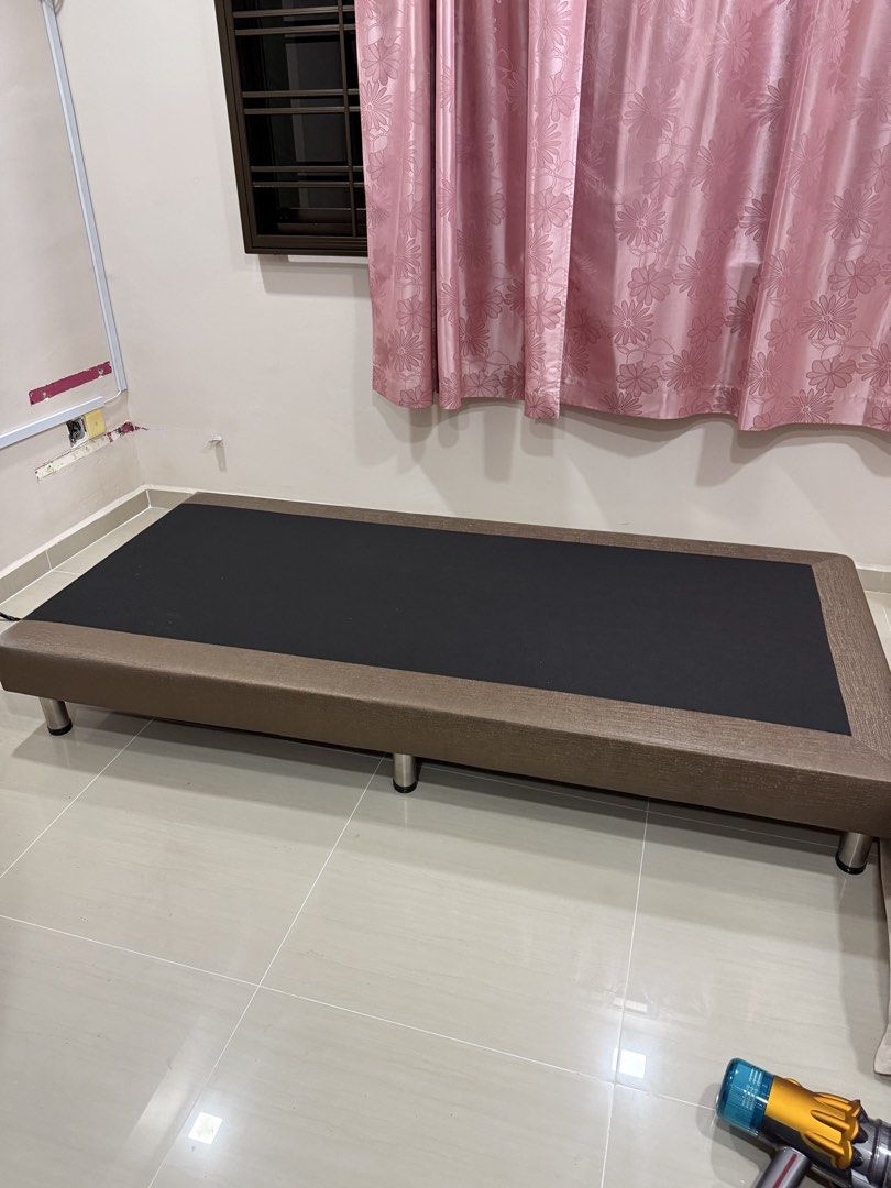 Bed frames (Category: Bed Frames & Mattresses) located in Singapore. Submitted by breakthelight (Listing ID 1453380473, Image 3). Description: Single bed frame. Beige/brown upholstery with tufted headboard. Sturdy platform base. Both for $50.