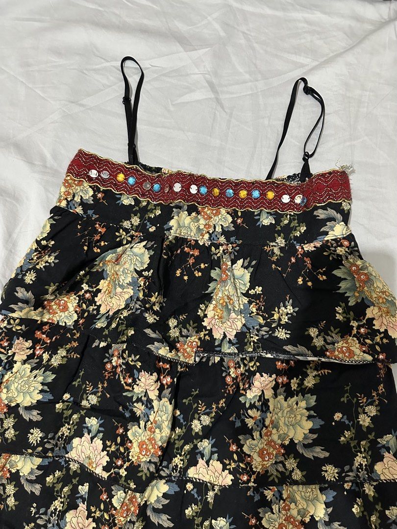 Black Floral Tiered Top with Beaded Neckline (Category: Dresses) located in Pasig City. Submitted by polyhedra_ (Listing ID 1453344228, Image 2). Description: - Cute black mini dress - Pretty floral print - Flowy tiered design - Beaded neckline detail - Adjustable spaghetti straps - Ideal for casual wear or beach trips.
