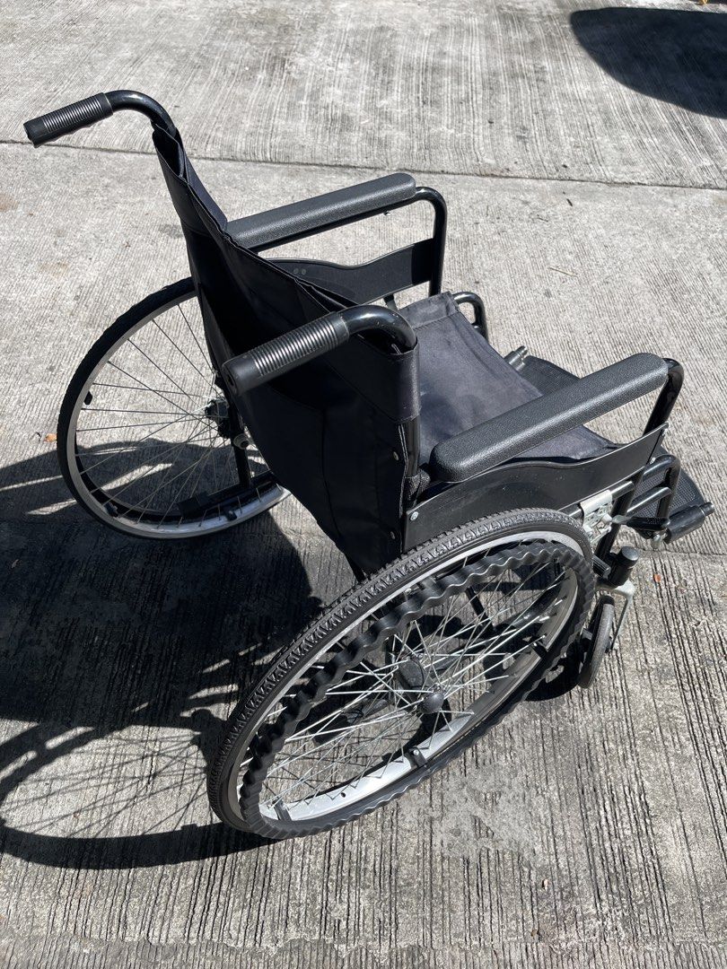 Black Folding Wheelchair with Large Wheels (Category: Wheelchairs) located in Rizal. Submitted by royale23 (Listing ID 1453271258, Image 2). Description: - Standard wheelchair for mobility - Folds easily for storage and transport - Large rear wheels for enhanced stability - Padded armrests and backrest for maximum comfort - Ready for its next owner - Ideal for everyday use and getting around.