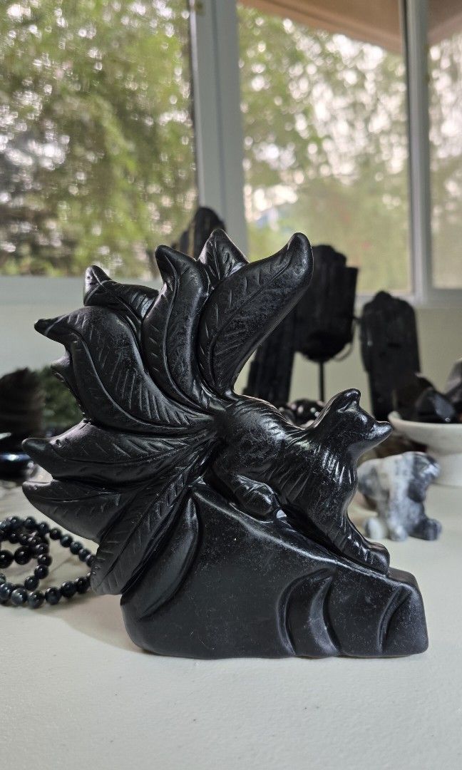 Black Obsidian Nine Tailed Fox Carving (Category: Precious Stones) located in Taguig. Submitted by c_rivera (Listing ID 1453269943, Image 2). Description: black obsidian carving with certificate. Negative Energy Shield: Acts as an energetic vacuum cleaner to absorb and clear stress, psychic attacks, and environmental negativity. Deep Grounding: Connects with the root chakra to anchor your energy, providing stability and security during chaotic ti