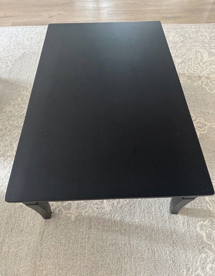 Black Rectangular Coffee Table (Category: Tables & Sets) located in Singapore. Submitted by feminist (Listing ID 1453358651, Image 2). Description: - Sleek rectangular coffee table - Four sturdy legs for stability - Smooth and spacious top surface - Modern design, complements most living rooms - Perfect for drinks, books, and decor - Easy to maintain and clean Available in Dark Walnut Dimension Height :38 cm Length :110 cm Width : 70 cm PLS ARRAN