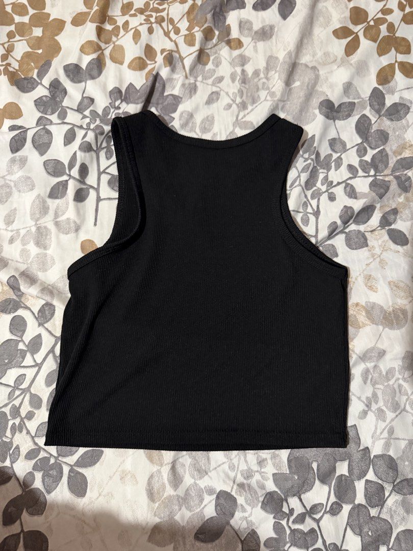 Black Ribbed Racerback Crop Tank Top (Category: Sleeveless) located in Taytay. Submitted by cloudy_20 (Listing ID 1453376106, Image 1). Description: Basic black ribbed tank top. Cropped, racerback style. Comfortable and stretchy, perfect for any outfit. Can fit S-M.