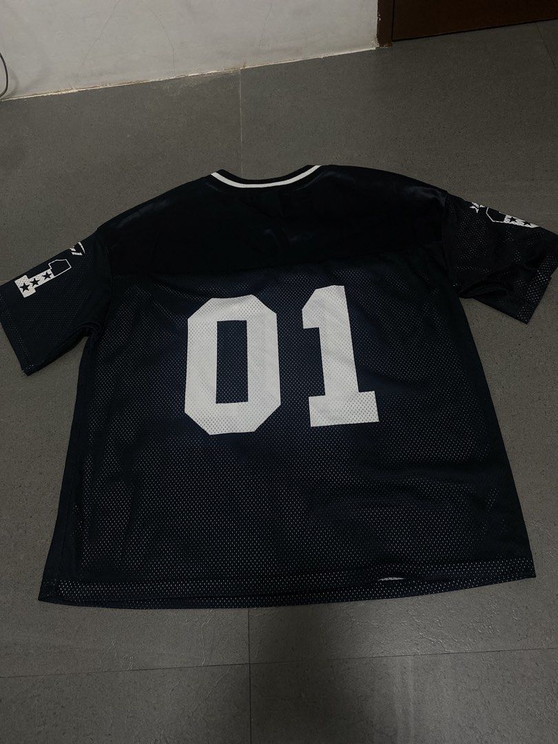 Black Varsity Jersey "01" with White Accents (Category: Activewear) located in Manila. Submitted by ellianaaaa (Listing ID 1453315847, Image 2). Description: - Black mesh jersey - '01' graphic on front and back - White star and stripe details on sleeves - V-neck collar - Sports-inspired streetwear design - Ideal for casual wear or making a statement - Small to Large.