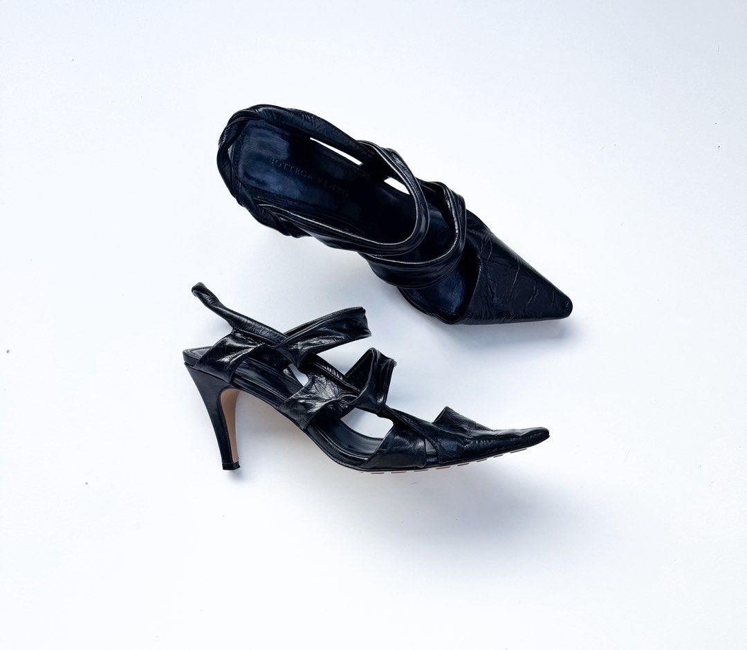 Bottega Veneta "The Point" Slingback Pumps (Category: Heels) located in Davao. Submitted by LUXURY (Listing ID 1453331303, Image 1). Description: Chic black leather Bottega Veneta heels. Features a strappy, pointed toe design with a slingback heel and a unique twisted leather detail. Perfect for elevating any look. Size 38 Pair only Visit my profile for more luxury items.