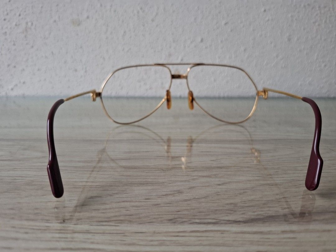 Cartier glasses (Category: Sunglasses & Eyewear) located in Makati City. Submitted by noxcom (Listing ID 1453269655, Image 3). Description: - Gold aviator style eyeglasses - Burgundy colored temples - Perfect for everyday wear or as a fashion statement.