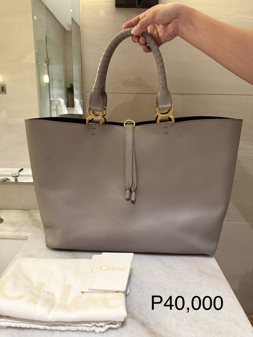 Chloe Tote Bag - Grey Leather (Category: Luxury Bags & Wallets) located in Quezon City. Submitted by rhonadc (Listing ID 1453334978, Image 1). Description: - Authentic Chloe grey leather tote bag - Comes with original dust bag and authenticity cards - Elegant gold hardware details - Spacious interior for all your essentials - Ideal for everyday use or travel.