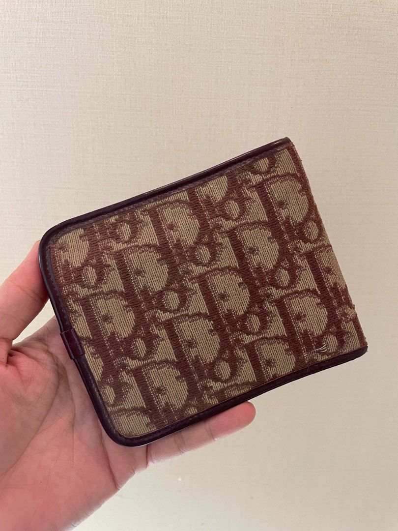 Christian Dior Monogram Canvas Bifold Wallet (Category: Luxury Bags & Wallets) located in Manila. Submitted by luxblocc (Listing ID 1453269435, Image 2). Description: - Authentic Christian Dior wallet - Classic Diorissimo monogram canvas exterior - Rich burgundy leather interior - Made in France - Multiple card slots - Spacious bill compartment - A timeless essential.