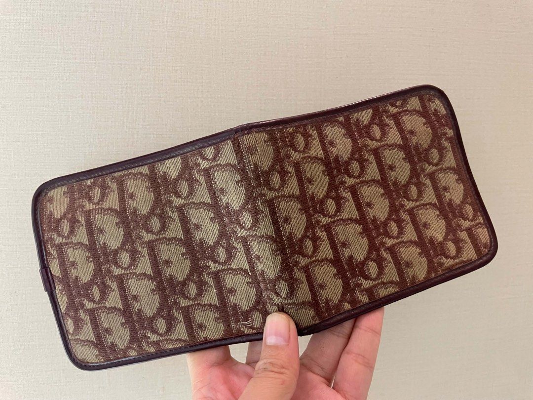 Christian Dior Monogram Canvas Bifold Wallet (Category: Luxury Bags & Wallets) located in Manila. Submitted by luxblocc (Listing ID 1453269435, Image 3). Description: - Authentic Christian Dior wallet - Classic Diorissimo monogram canvas exterior - Rich burgundy leather interior - Made in France - Multiple card slots - Spacious bill compartment - A timeless essential.