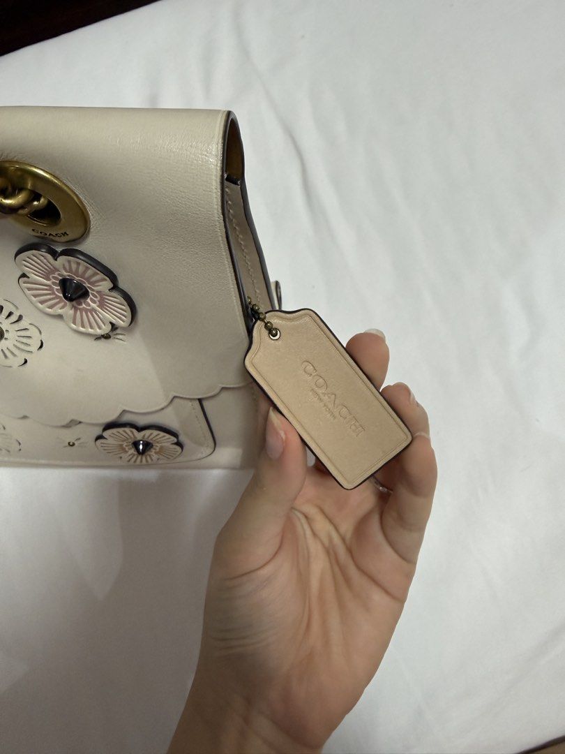 Coach Parker tea rose cutout (Category: Luxury Bags & Wallets) located in Quezon City. Submitted by tiaraless_ (Listing ID 1453242062, Image 2). Description: Original Coach Parker Tea Rose Cutout. Used with some signs of use. With dust bag.