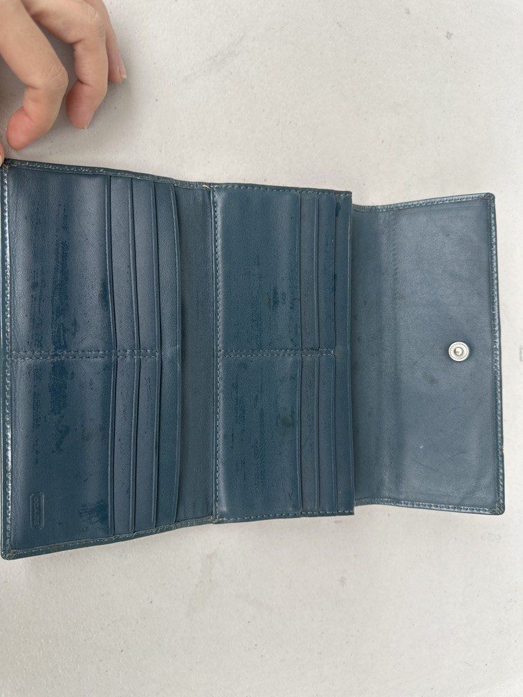 Coach Signature Tri-Fold Wallet (Category: Wallets & Card holders) located in Manila. Submitted by classywardrobemanila (Listing ID 1453281787, Image 3). Description: COACH Tri-fold Long Wallet Signature canvas blue GENUINE LEATHER Stitched billfold coin purse Width: Approximately 19 cm, Height: Approximately 9.5 cm As this is a used item, there are signs of scuffing on the edges and the dirt on some areas but in general it is still in great cond