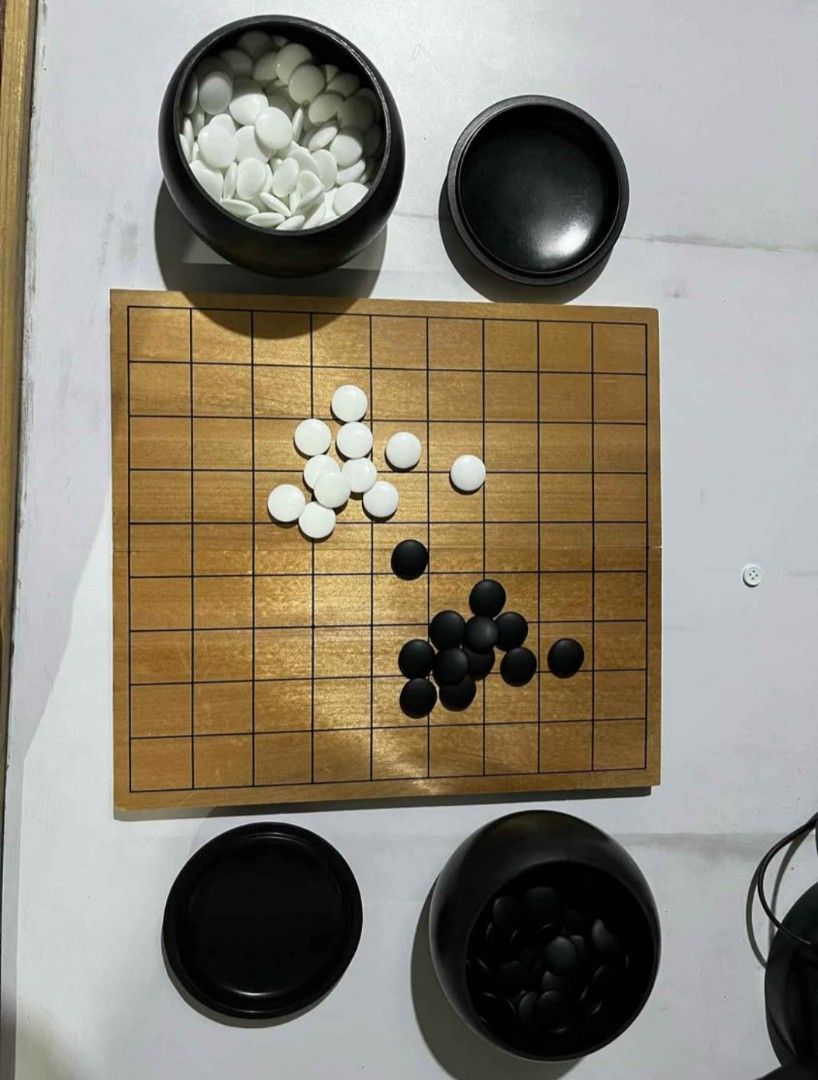 Complete Go Stones (Category: Educational & Learning Toys) located in Abucay. Submitted by garuj (Listing ID 1453264894, Image 1). Description: Go stones 181 black & 180 white stones good condition wood board 250php.